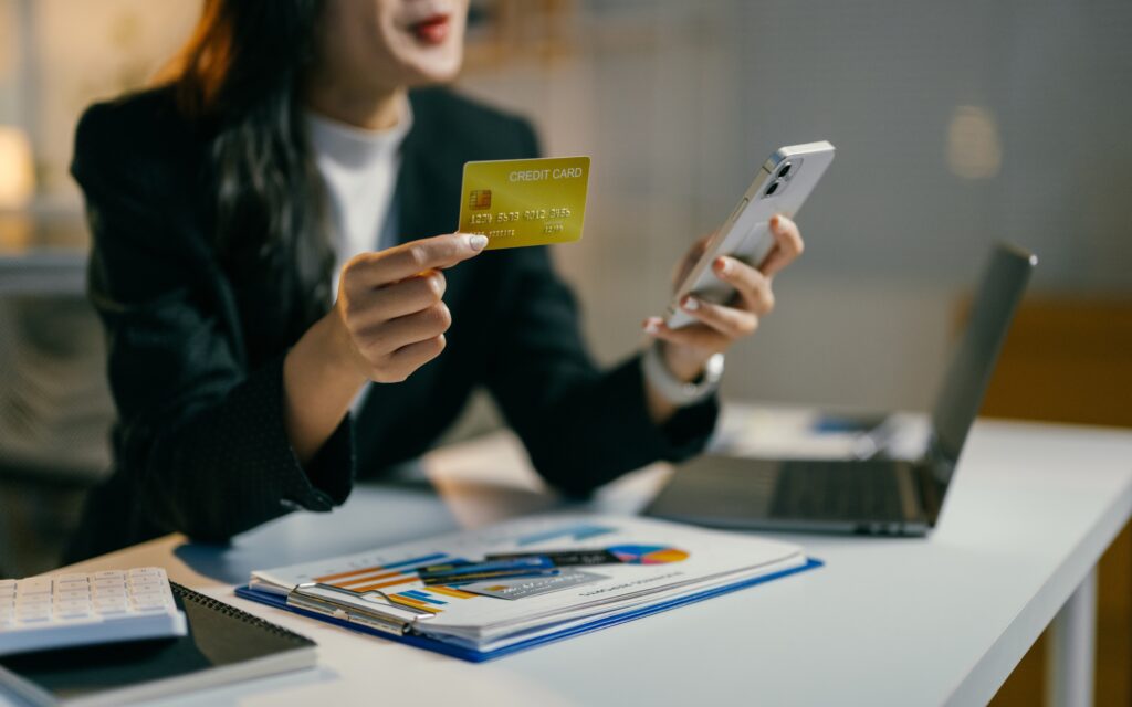 A businesswoman handles payment gateway fees. These fees can sometimes be confusing.