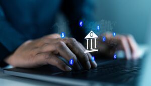 Fingers on a keyboard, handling hidden payment gateway fees in Malaysia.