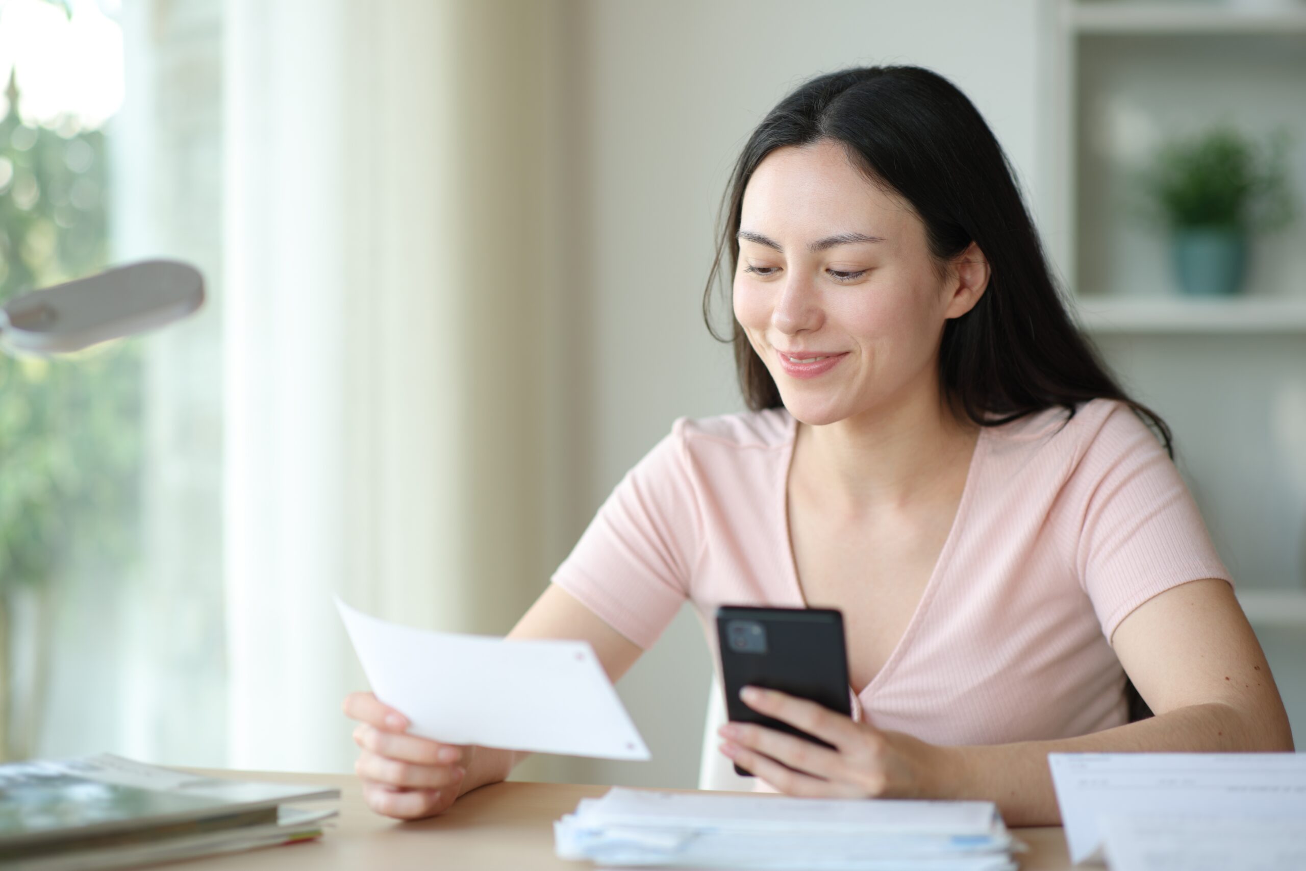 A woman pays online. Poor design decisions at checkout can be why customers abandon online payments.