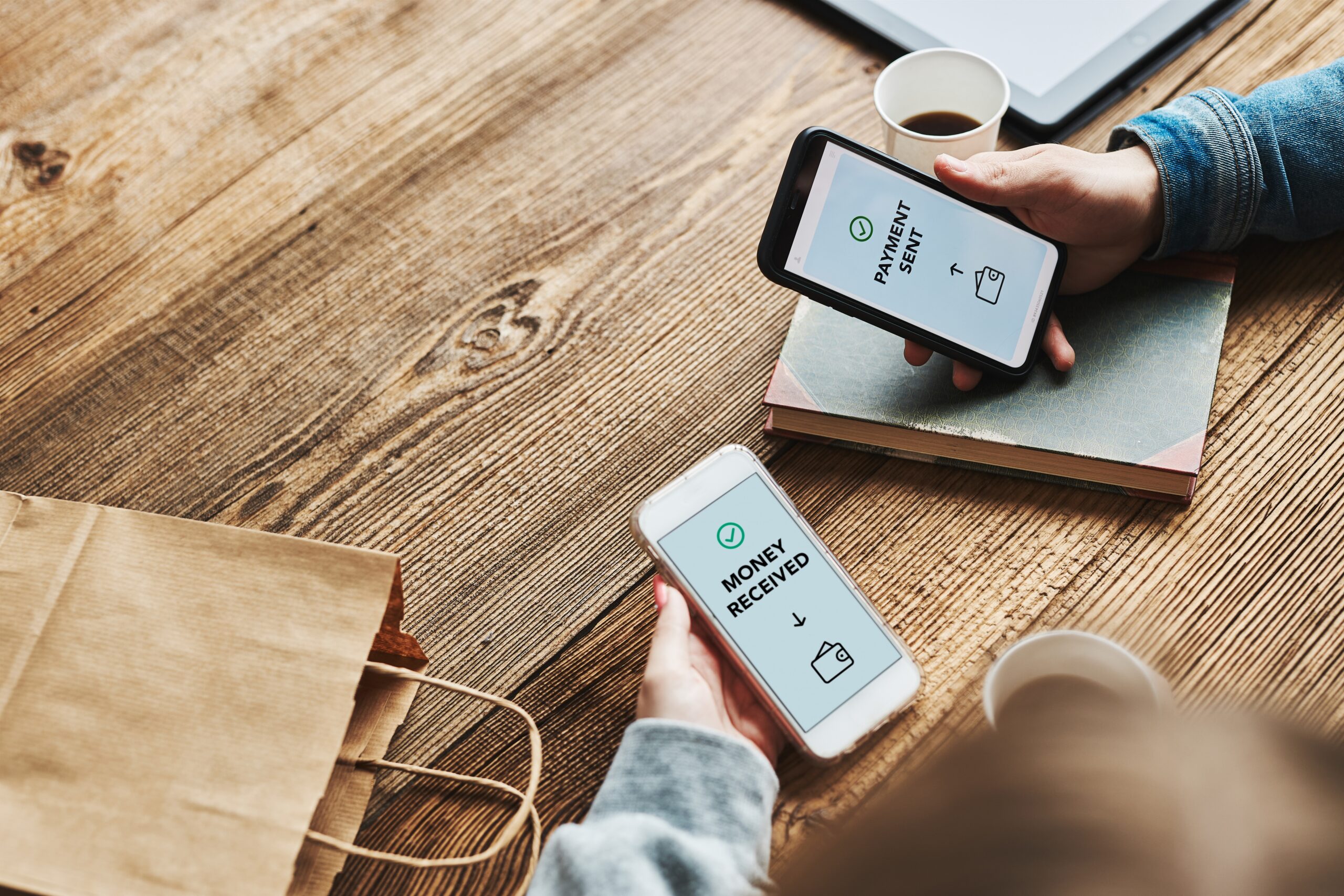 Two smartphones showing how to get paid online without a website in Malaysia