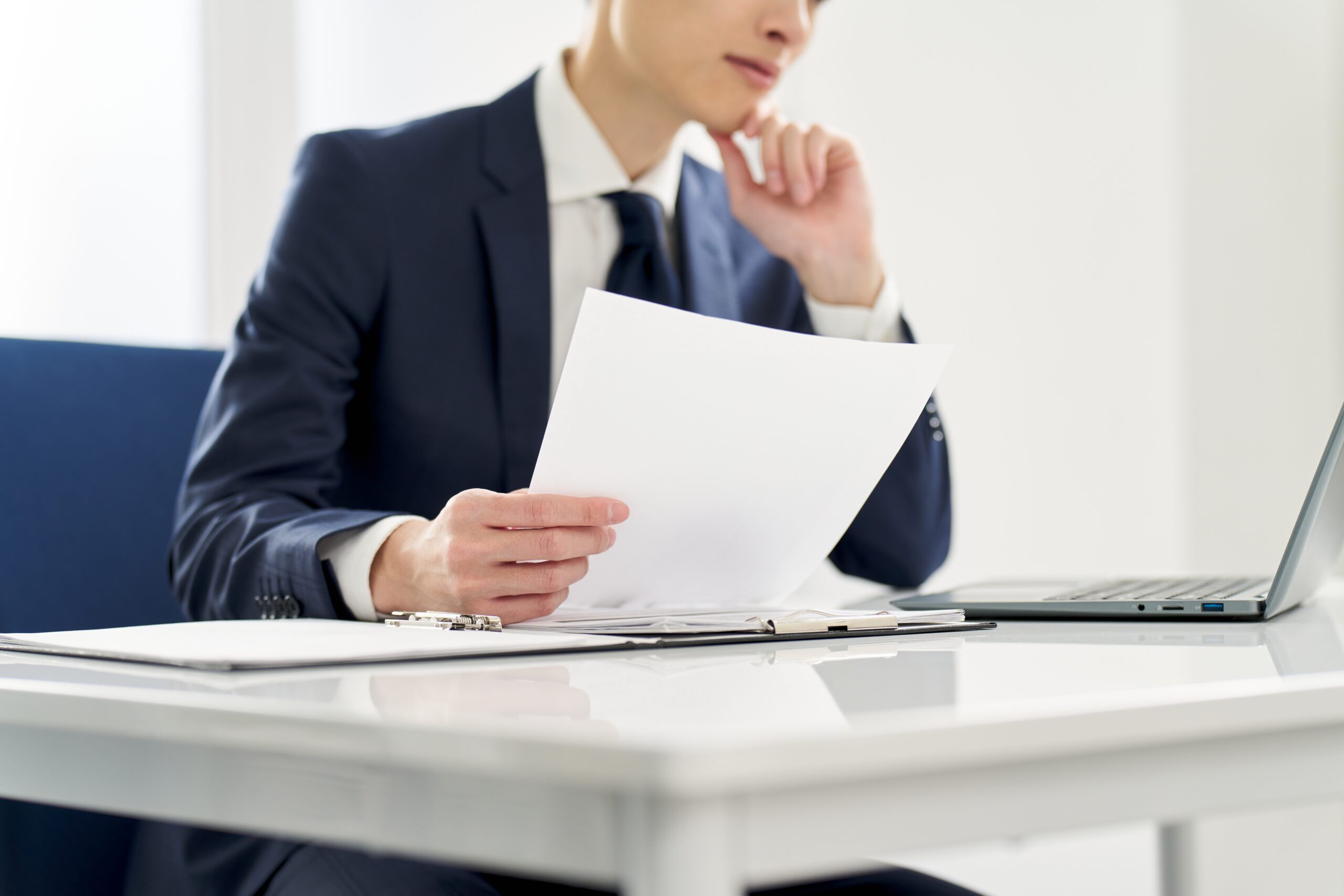 A businessman working to tackle payment receipt fraud for his operations in Malaysia. 