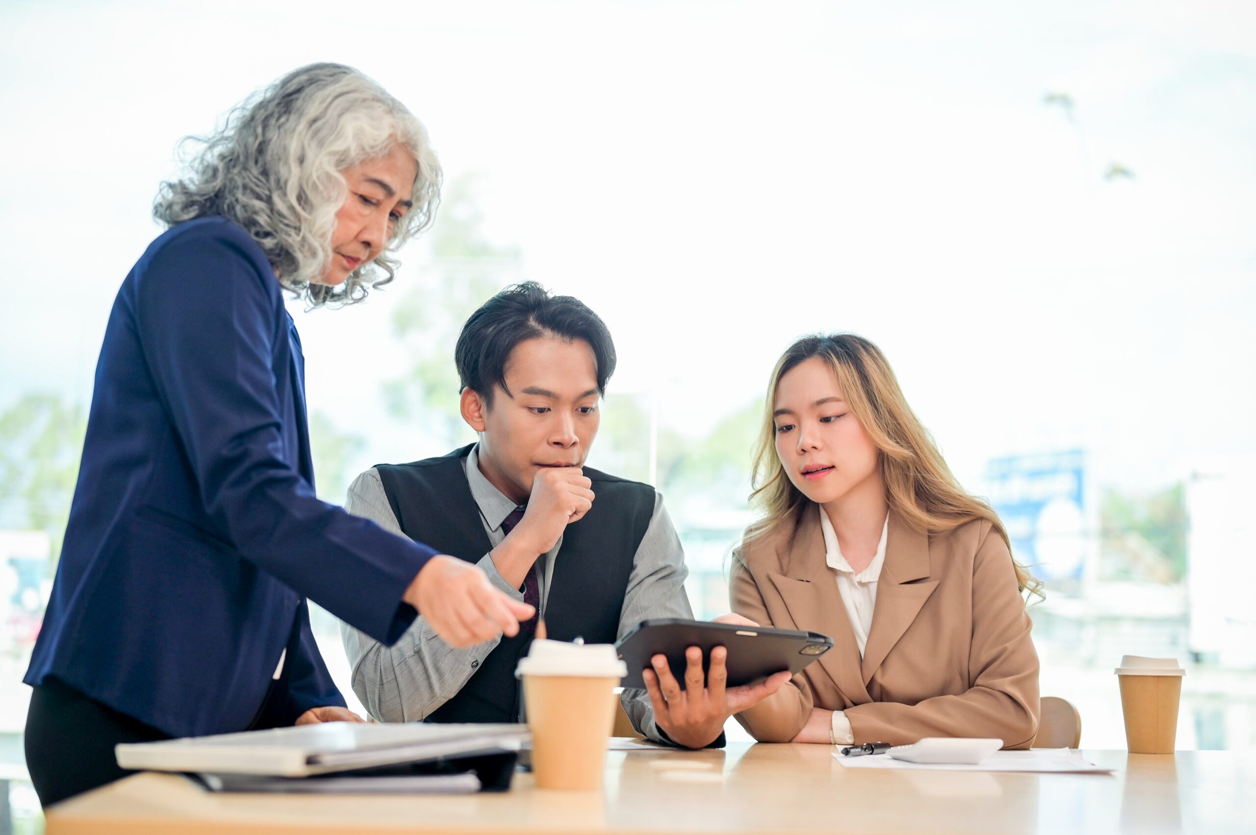 A business team discussing why recurring payments fail and how to reduce failed recurring payments.