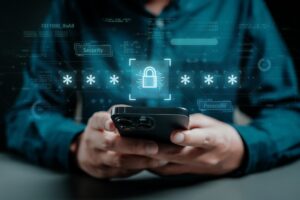Person holding smartphone entering passcode to complete 3D secure authentication for online payment