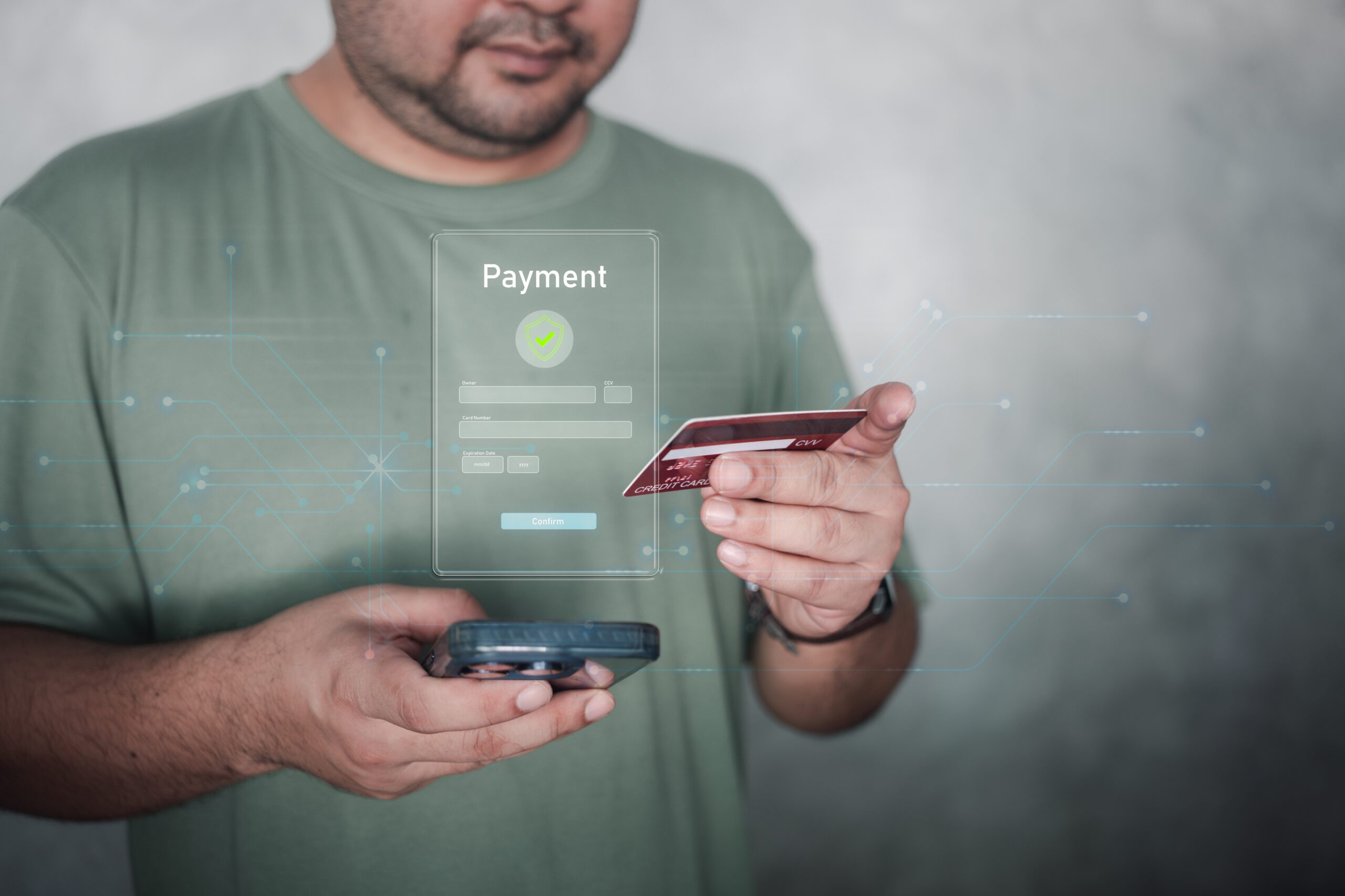 Man making an online payment with a credit card and smartphone