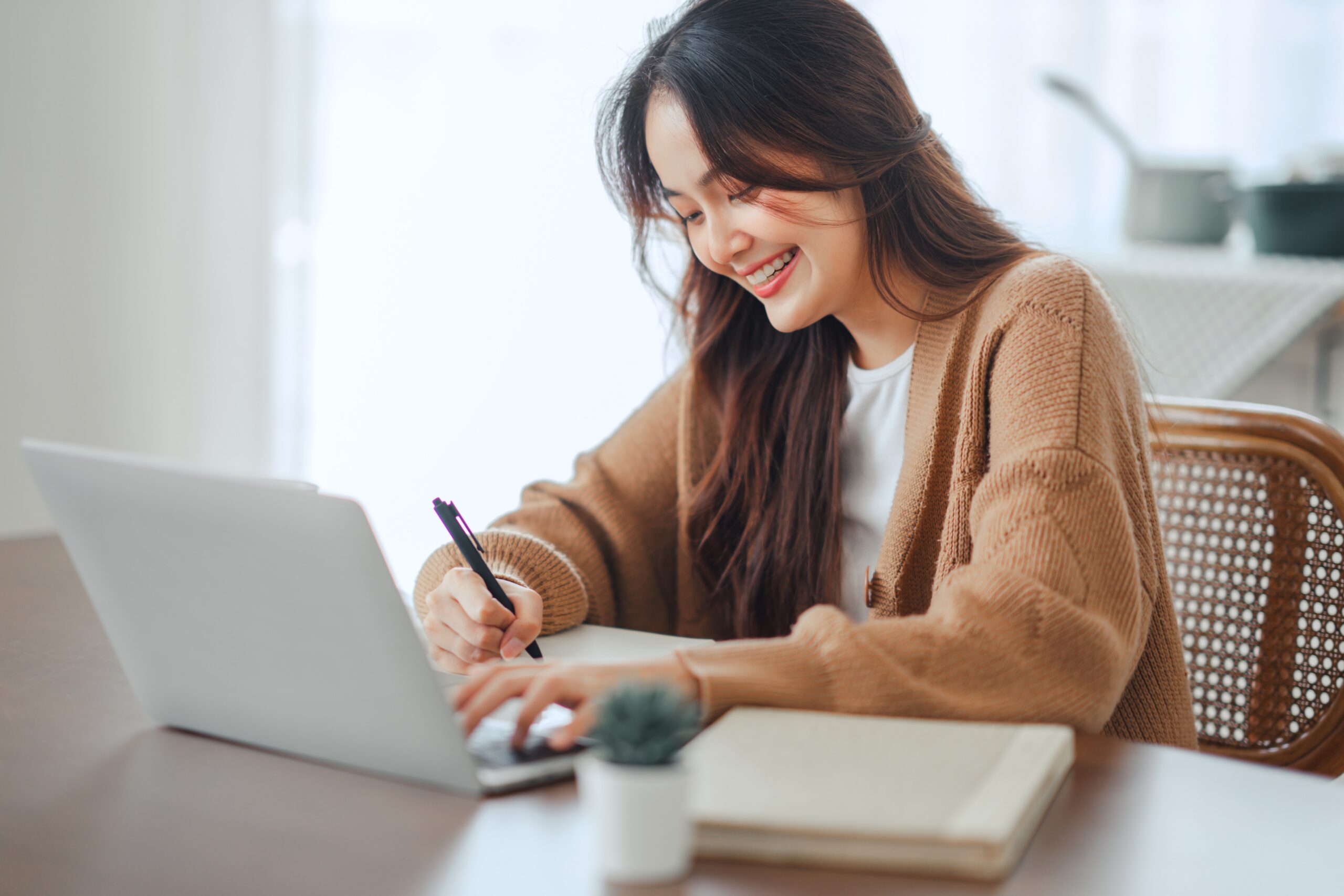 A businesswoman contemplating the cost of a payment gateway in Malaysia for her business.