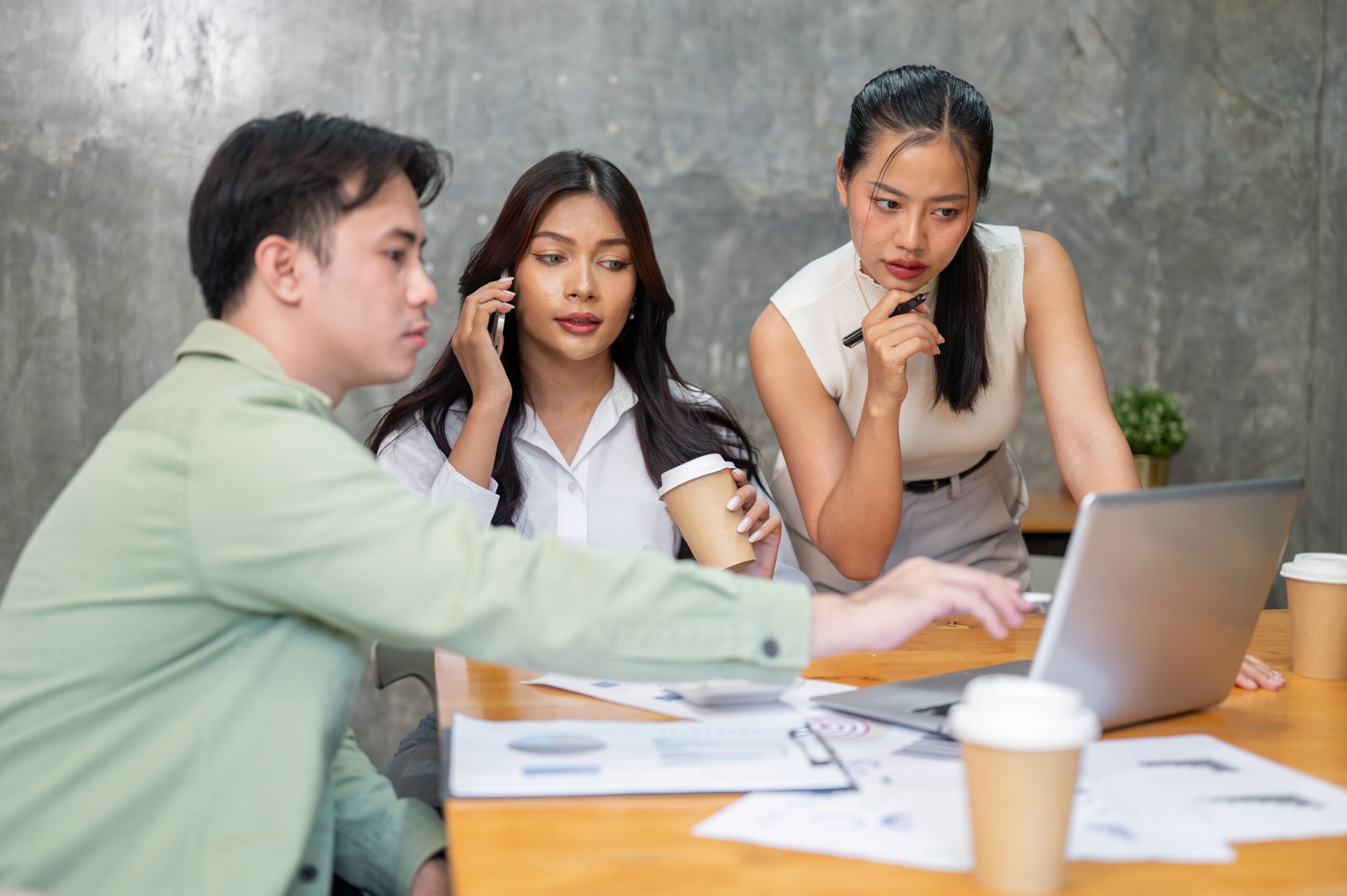 A small business team pricing comparisons for a payment gateway provider in Malaysia.